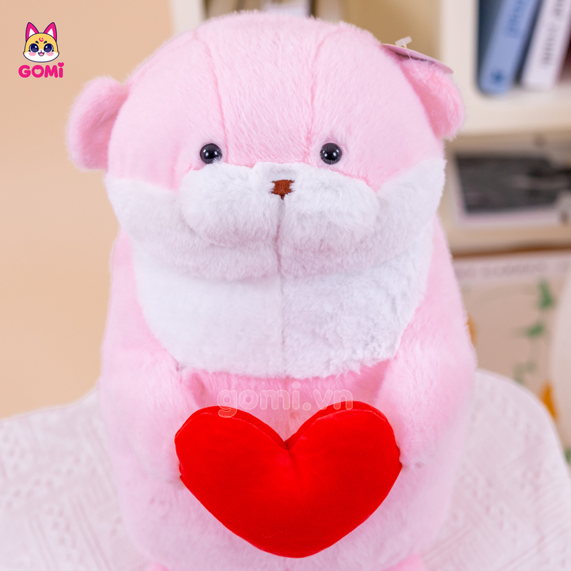Gấu Bông Rái Cá Hồng Ôm Tim