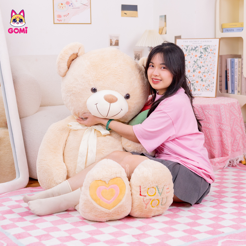 Gấu Bông Teddy Nơ Cầm Hoa
