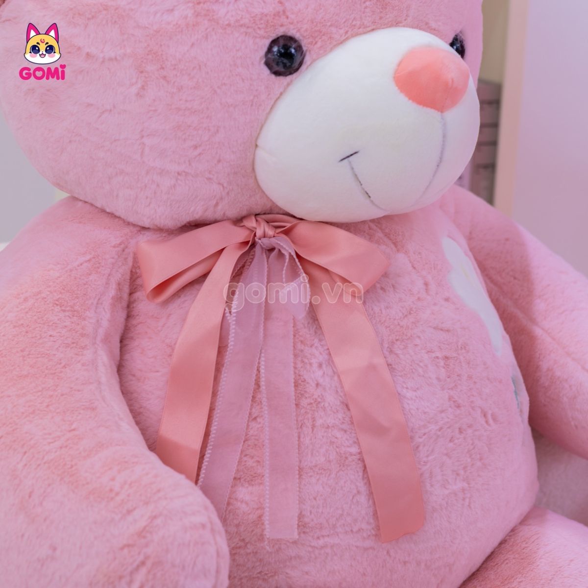 Gấu Bông Teddy Ngực Cành Hoa